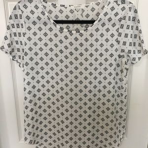 White blouse. Black accents.